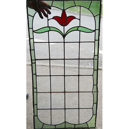 1041 - A collection of leaded and stained glass window panels with varying foliate design, (varying size, s... 