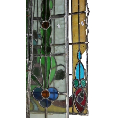 1041 - A collection of leaded and stained glass window panels with varying foliate design, (varying size, s... 