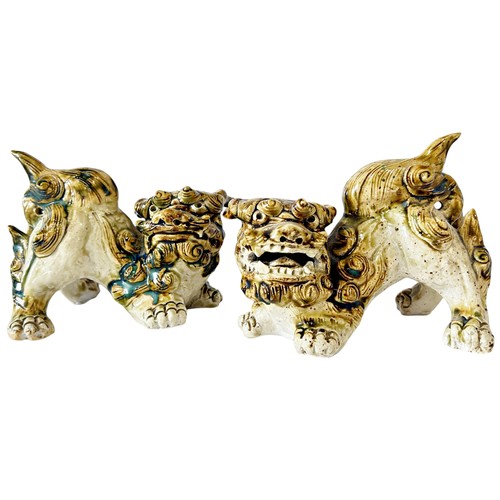 79 - A pair of Chinese stoneware Temple Lions with heavy sancai type glazed finish, 16cm length (max) (2)