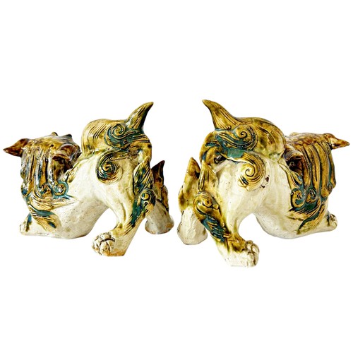 79 - A pair of Chinese stoneware Temple Lions with heavy sancai type glazed finish, 16cm length (max) (2)