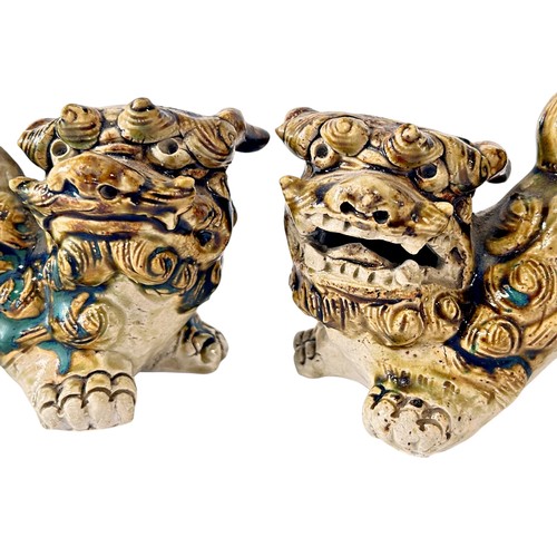 79 - A pair of Chinese stoneware Temple Lions with heavy sancai type glazed finish, 16cm length (max) (2)