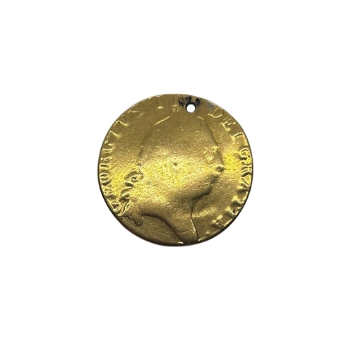 56 - George III, 1760-1820, a gold spade Guinea (drilled, year rubbed).