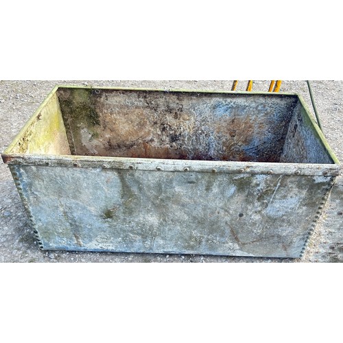 A reclaimed rectangular heavy gauge galvanised steel water trough with ...