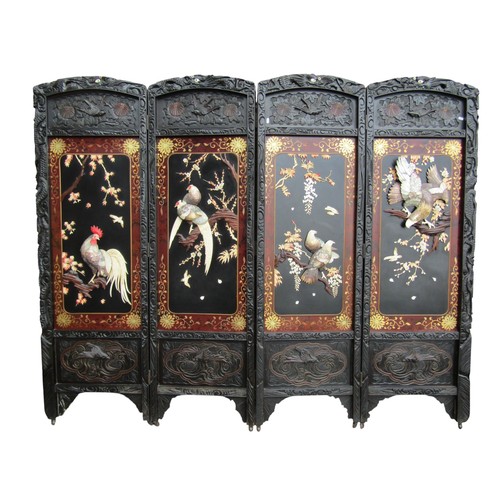 A fine quality Japanese Shibayama Meji period four fold screen or room divider, the individual panels depicting birds amongst flowering tree branches in carved bone, mother of pearl and ivory, set within gilded borders with carved dragon cresting rails, each panel 182cm high x 57cm, overall width 227cm. Ivory Submission Reference: SSUFR4TG
