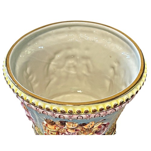 42 - A Capodimonte jardinière with relief moulded detail of dancing characters