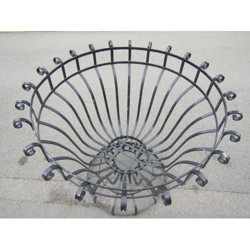 1047 - A large open strapwork planter of circular tapered form with simple repeating scroll detail, 111 cm ... 