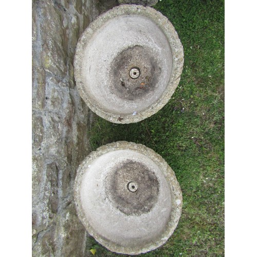 1059 - A pair of weathered cast composition stone garden urns and loose socles with acanthus detail, 48 cm ... 