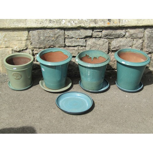 1005 - Four contemporary green glazed terracotta flower pots including a Heritage garden pottery example to... 