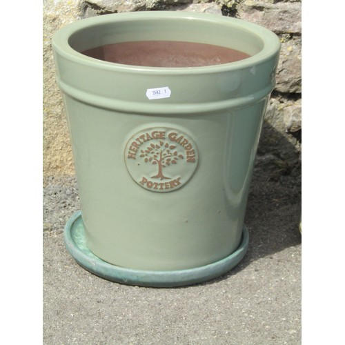 1005 - Four contemporary green glazed terracotta flower pots including a Heritage garden pottery example to... 