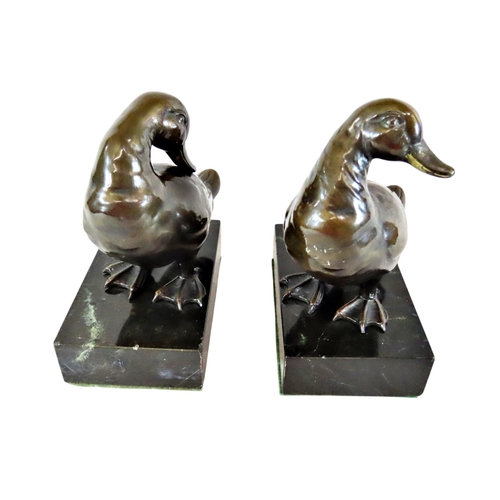 57 - A good pair of late 19th / early 20th century continental bronze ducks, each mounted on polished bla... 
