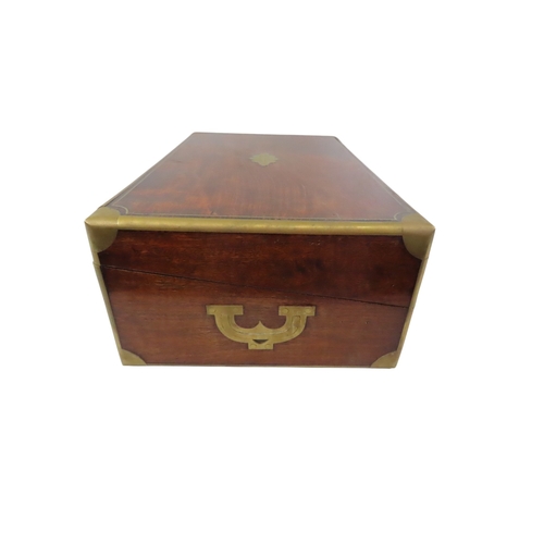 23 - A good William IV mahogany writing slope, with brass banded borders and corners, flanked with flush-... 