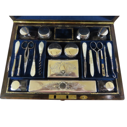 24 - A good early Victorian coromandel cased lady’s travelling dressing set, the hinged cover with vacant... 