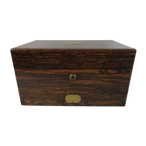 24 - A good early Victorian coromandel cased lady’s travelling dressing set, the hinged cover with vacant... 