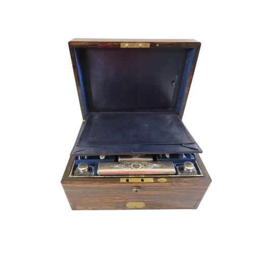 24 - A good early Victorian coromandel cased lady’s travelling dressing set, the hinged cover with vacant... 