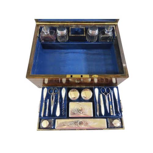24 - A good early Victorian coromandel cased lady’s travelling dressing set, the hinged cover with vacant... 