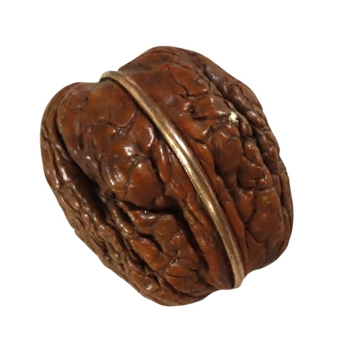 11 - A French natural walnut miniature sewing etui for a child or doll, gilt hinge mount, the lid interio... 