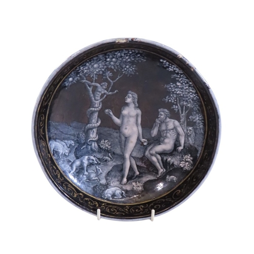 A rare 16th century Limoges grisaille & gilt enamel bowl, decorated internally with a narrative scene, ‘Adam & Eve eating the forbidden fruit’, after the print by Étienne Delaune, Adam seated eating an apple as Eve talks with the anthropomorphised serpent, with animals throughout the scene, with faint gilt wash shadows of trees beyond, with scrolling gilt border, underside with white and gilt trailing swags, (missing central foot) 62cm high, 19cm diameter, c1550-80

Provenance: from the estate of Henry Lane Eno (1871-1928), thence by descent.

Footnote: The central scene is a mirror-image section after a print by Etienne Delaune (French, c. 1518-1583) (Cf. Baltimore Museum of Art with a print by Stefano Scolari (Italian, 1640 - 1691) after Delaune Object Number 1946.112.1072). The Limoges artist has altered certain elements slightly but retained the essential composition and details such as the sleeping dog and feeding squirrel. The Louvre holds in its collection a plate attributed to Jean Miette entitled “Le Péché d'Adam et Eve” that draws upon the same artistic inspiration. The handling of the details and anatomy are slightly different from this example but it shares the artist's willingness to incorporate animals of all types, a feature also seen on another work attributed to Miette, ‘The Creation of Adam’ on a plate in the British Museum. See also the Fitzwilliam Museum's cup and cover depicting the creation of Adam by Jean Court (Vigier) (Accession Number: M.31 & A-1933). The stylistic depiction of the foliage to the tree and ground, and the detailing of animals suggest a kinship with the artist responsible for this bowl.