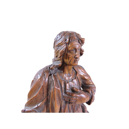 36 - A good early continental ecclesiastical carved boxwood figure, likely depicting St. John the Evangel... 