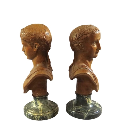 38 - an associated pair of decorative Italian carved limewood or pine busts after Roman emperors, likely ... 