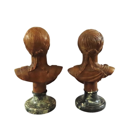 38 - an associated pair of decorative Italian carved limewood or pine busts after Roman emperors, likely ... 
