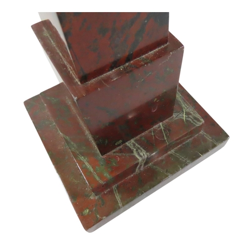 45 - A Grand Tour style polished red marble obelisk, on stepped square base, 37cm high
