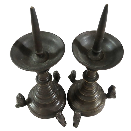 52 - A good pair of early continental ecclesiastical cast bronze pricket candlesticks, with flared bowls ... 