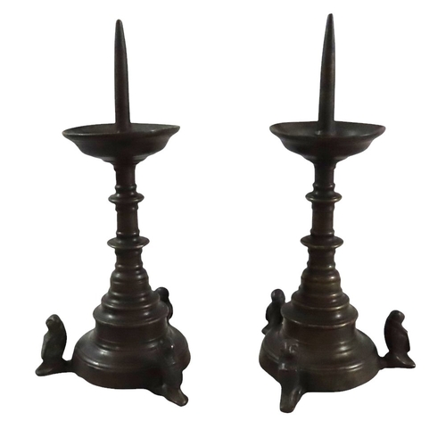 52 - A good pair of early continental ecclesiastical cast bronze pricket candlesticks, with flared bowls ... 