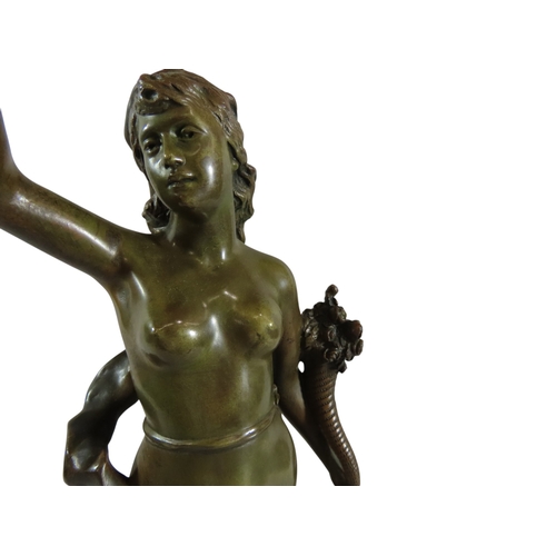 55 - A French Art Nouveau bronze figure,'Les Roses', modelled as a female nude, holding flowers, standing... 