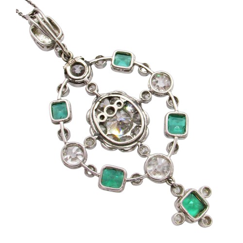 290 - A fine Edwardian diamond and emerald pendant, of open-worked circular form, the central diamond 0.78... 