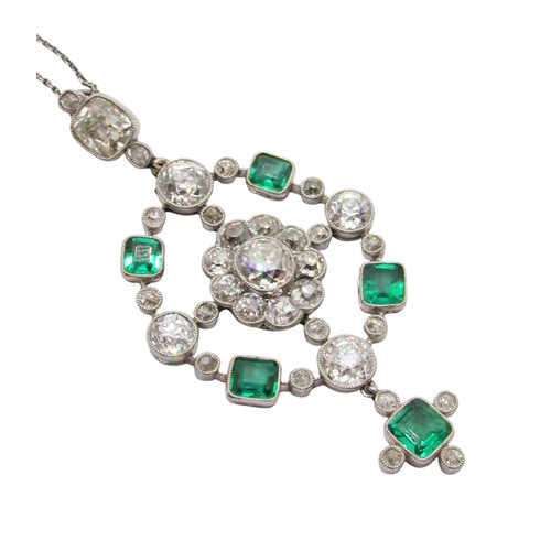 290 - A fine Edwardian diamond and emerald pendant, of open-worked circular form, the central diamond 0.78... 