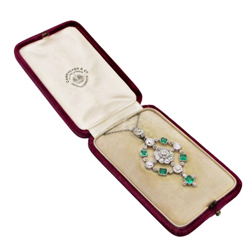 290 - A fine Edwardian diamond and emerald pendant, of open-worked circular form, the central diamond 0.78... 