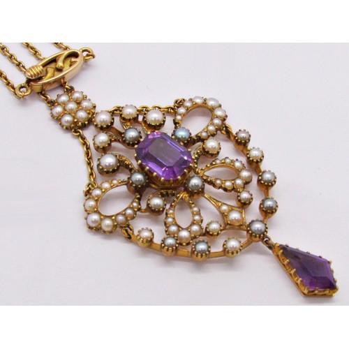 313 - A fine Edwardian seed pearl and amethyst set pendant, the central stone encircled within a hinged op... 