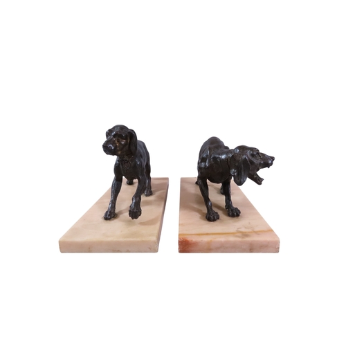 51 - A pair of 19th century French bronze animalier models of opposing dogs, with well patinated finish t... 