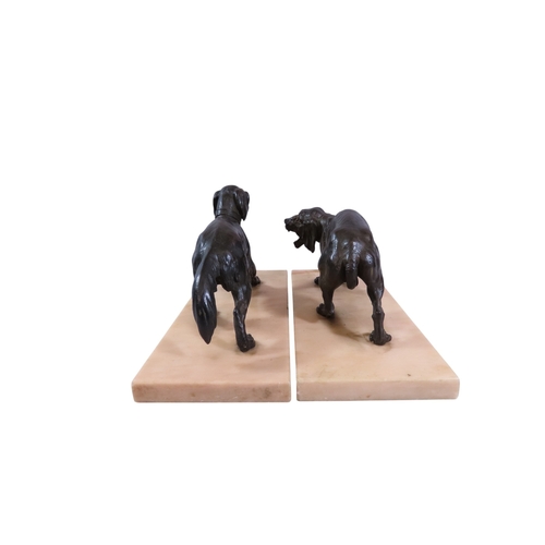 51 - A pair of 19th century French bronze animalier models of opposing dogs, with well patinated finish t... 