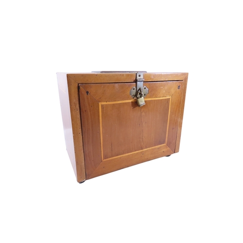 28 - A South German Augsburg-type walnut table cabinet, the exterior with simple boxwood stringing and ap... 