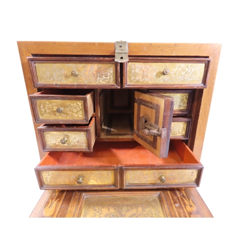 28 - A South German Augsburg-type walnut table cabinet, the exterior with simple boxwood stringing and ap... 