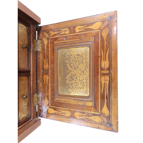 28 - A South German Augsburg-type walnut table cabinet, the exterior with simple boxwood stringing and ap... 