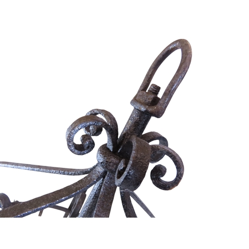 34 - An old continental two tier wrought iron game crown, fitted with 42 hooks over two tiers, 62cm diame... 