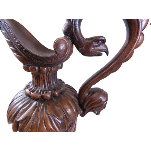 35 - An unusual, large pair of 19th century Italian carved walnut sealed ewers, with swept handles termin... 