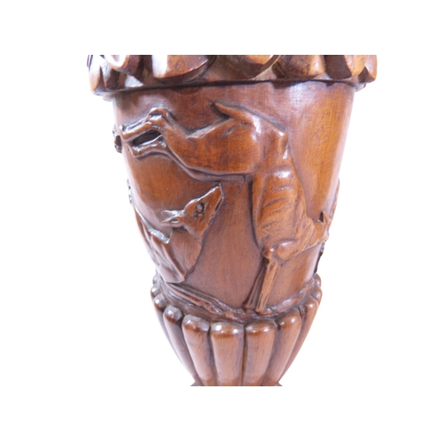 35 - An unusual, large pair of 19th century Italian carved walnut sealed ewers, with swept handles termin... 