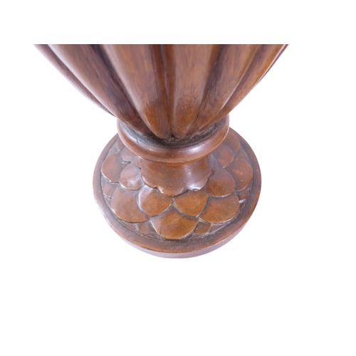 35 - An unusual, large pair of 19th century Italian carved walnut sealed ewers, with swept handles termin... 