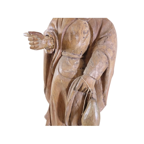 39 - A large early continental carved ecclesiastical fruitwood figure depicting St. Roche, raised on box ... 