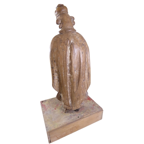 39 - A large early continental carved ecclesiastical fruitwood figure depicting St. Roche, raised on box ... 
