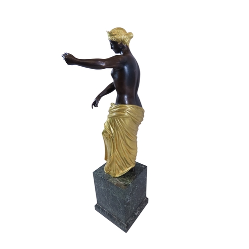48 - A Late 18th / early 19th century continental patinated and gilt bronze figure of Venus, presented in... 