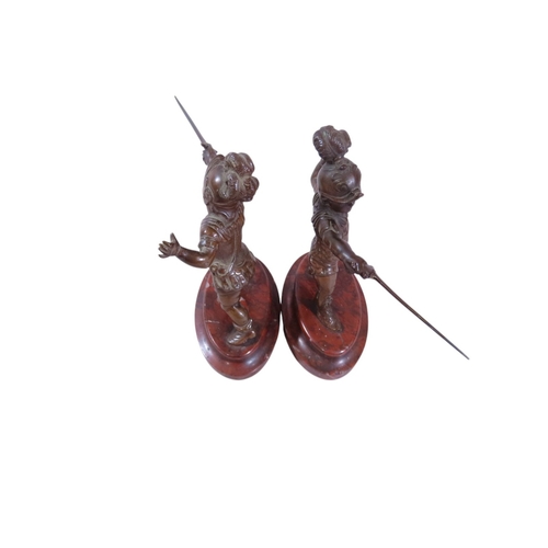 9 - A pair of 19th century continental bronze figures, humorous opposing dueling infants presented with ... 