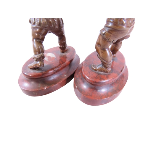 9 - A pair of 19th century continental bronze figures, humorous opposing dueling infants presented with ... 