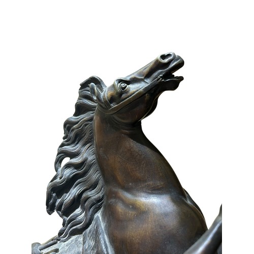 60 - After Guillaume Coustou (French, 1677-1746) a good pair of 19th century French patinated bronze mode... 