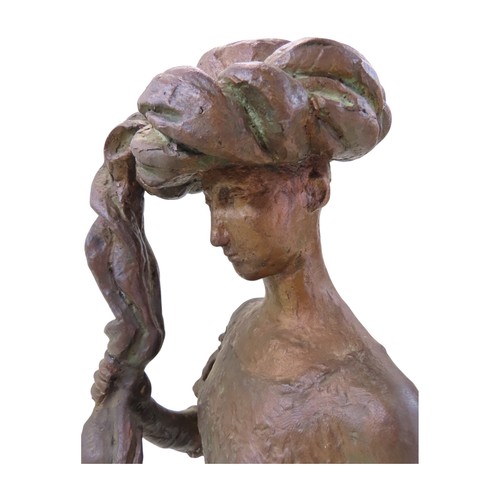 574 - A bronze statue by Tone Thiis Schjetne 1928-2015, female with turban hat, 42cm high
