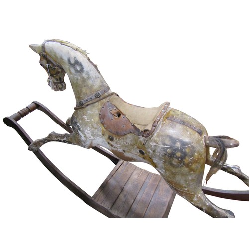 1406 - An Edwardian dapple grey rocking horse by G & J Lines, on a bow rockers, length 183cm, height to sad... 