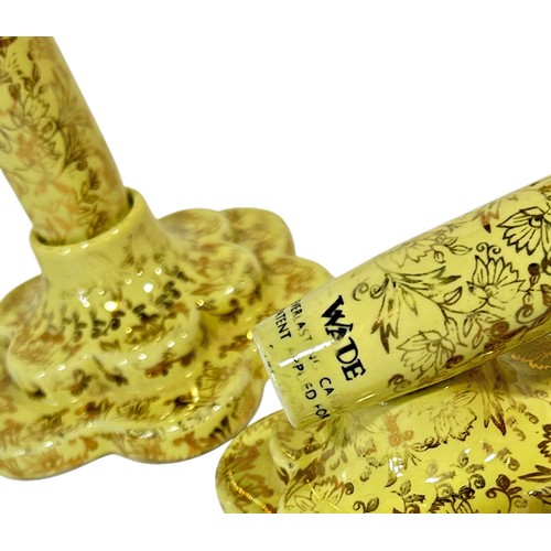 37 - A pair of Wade Everlasting candlesticks in yellow and gilt